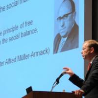 Michael Eilfort, director of the Berlin-based think tank Stiftung Marktwirtschaft, discusses Germany\'s postwar social market economy model during a June 18 symposium at Keidanren Kaikan in Tokyo. | SATOKO KAWASAKI PHOTOS