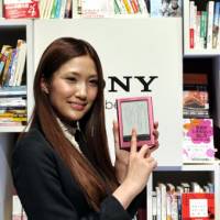 Page-turner: One of Sony Corp.\'s new e-book reading devices, the Reader Pocket Edition, is displayed during a news conference at the company\'s head office in Shinagawa Ward, Tokyo, on Thursday. | YOSHIAKI MIURA PHOTO