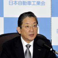 Car talk: Toshiyuki Shiga, chairman of the Japan Automobile Manufacturers Association and chief operating officer of Nissan Motor Co., is interviewed Wednesday in Tokyo. | YOSHIAKI MIURA PHOTO