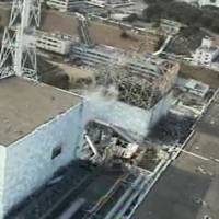 Investment factor: The buildings housing reactors  No. 2 (left) and 1 at the Fukushima No. 1 power plant are photographed from the air April 10 by a drone aircraft. | AP PHOTO