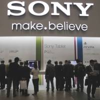 Gadget grab: Visitors crowd the Sony Corp. booth during an electronics show at Makuhari Messe in the city of Chiba on Oct. 4. | AP