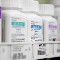 Money-maker: Bottles of Takeda Pharmaceutical Co.\'s Actos diabetes drug sit on shelves at a pharmacy in Atlanta in May. | BLOOMBERG