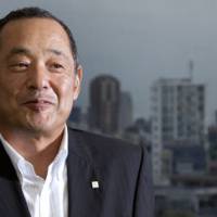On tap:  Tsutomu Kamijo, president of Sapporo Holdings Ltd., poses for a photo  Thursday in  Tokyo. | BLOOMBERG