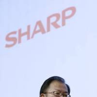 Sinking feeling: Takashi Okuda, president of Sharp Corp., engages in a news conference Thursday in Tokyo. | BLOOMBERG