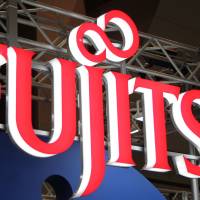 One of the players: The Fujitsu Ltd. logo is displayed at the e-Book Expo Tokyo in July. | BLOOMBERG