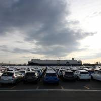 On the next tide: Toyota Motor Corp. cars, including Aqua hybrid compacts, wait to be loaded Friday at Sendai port. | BLOOMBERG