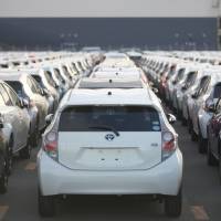 Outbound: Toyota Motor Corp. Aqua hybrid compacts await shipment at the port of Sendai in December. | BLOOMBERG