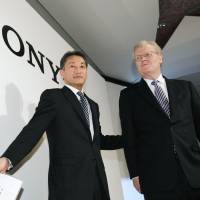The old and the new: Sony Corp. Chairman Howard Stringer and Kazuo Hirai, who succeeded him as president and CEO last April, leave a news conference in Chiyoda Ward, Tokyo, in February 2012. Stringer announced Friday that he will retire in June. | KYODO