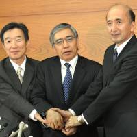 Monetary musketeers: New Bank of Japan Gov. Haruhiko Kuroda is flanked by deputies Kikuo Iwata (left) and Hiroshi Nakaso at BOJ headquarters Thursday. | AFP-JIJI