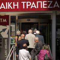?100,000 and hosed: People line up outside a Laiki branch in Nicosia on Friday as Cyprus reopened its banks for a second day under Draconian capital controls. Betray your bank before Slovenia betrays you