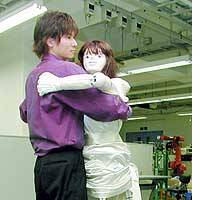 A graduate student at Tohoku University dances with a robot he helped develop at the university\'s campus in Sendai. | PHOTO COURTESY OF OMIYA LAW SCHOOL