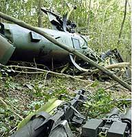 One of two GSDF attack helicopters that collided in midair during a training flight lies on a Mie Prefecture mountainside. | AKEMI NAKAMURA PHOTO