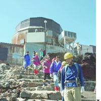 Atop mount fuji employees at the weather station here leave Friday after closing the facility, which has been regularly staffed since 1932. Weather observation from now on will be completely automated. | PHOTO COURTESY OF DEFENSE AGENCY