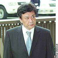 Yukihiro Yoshida, a former LDP lawmaker, enters the Tokyo District Court to attend the opening of his trial on charges of vote-buying. | PHOTO COURTESY OF DEFENSE AGENCY