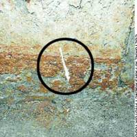 Damage caused by a researcher to an ancient mural inside the Takamatsuzuka Tomb in Nara Prefecture is indicated by a circle in this undated photo. | JAPAN AEROSPACE EXPLORATION AGENCY PHOTO/KYODO
