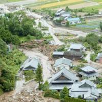 Flooding and landslides caused by Typhoon Shanshan leave a wake of destruction in Karatsu, Saga Prefecture, on Saturday. | KYODO PHOTO