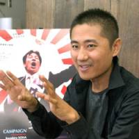 Kazuhiro Soda, director of the documentary \"Campaign,\" talks about the film in Tokyo last month. | SATOKO KAWASAKI PHOTO