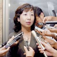 Former posts and telecommunications minister Seiko Noda faces reporters Friday after the Lower House plenary session. | KYODO PHOTOS