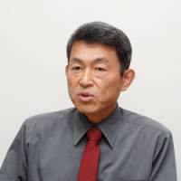 Cancer patient Nobuhito Kiyosato is interviewed in Tokyo last month. | YOSHIAKI MIURA PHOTO