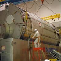 High hope: Kibo, Japan’s space station lab, seen in this undated NASA photo, is lowered into a shipping crate in preparation for transport to the Kennedy Space Center in Florida, where it is scheduled to be launched Saturday aboard the space shuttle Discovery. Kibo, Lexus of space labs, poised for launch