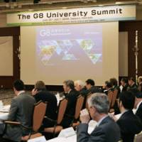 Theoretical groundwork: Officials from 34 universities in 14 countries discuss the G8 summit in Sapporo on Monday. | KYODO PHOTO