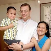 Happy together: Marc Van Cauteren and Reiko Shinozaki pose with their son, Arno, at their house in Meguro Ward, Tokyo, in June. | YOSHIAKI MIURA PHOTO
