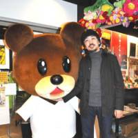 Animated: Ryo Ono hangs out with one of the characters from his award-winning film \"The Eagle Talon\" in his office in Chiyoda Ward, Tokyo. | SATOKO KAWASAKI PHOTO