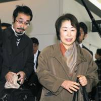 Rendezvous: Freed hostage Keiko Akahane\'s mother, Chieko, and older brother, Chihiro, leave Chubu International Airport in Aichi Prefecture for Paris Friday to meet up with her. | KYODO PHOTO