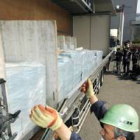 Take notice: A truck is readied to deliver public pension notices Friday in Urayasu, Chiba Prefecture. | KYODO PHOTO