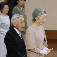 Golden moment: Emperor Akihito addresses a ceremony Friday at the Imperial Palace in Tokyo to fete his 50th anniversary with Empress Michiko. | KYODO PHOTO