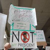 Making themselves heard: Iranians in Japan hold a rally Saturday near the Iranian Embassy in Tokyo to protest the outcome of the Iranian presidential election. | YOSHIAKI MIURA PHOTO