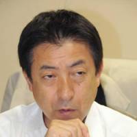 Hanging tough: Yasuhisa Shiozaki of the Liberal Democratic Party is interviewed Tuesday in his office in Tokyo. | SATOKO KAWASAKI PHOTO