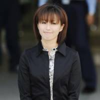 Coming clean: Singer and actress Noriko Sakai, who was arrested and indicted for using and possessing illegal stimulants, stands Thursday outside a police station in Tokyo\'s Daiba district to apologize to the public for her alleged misdeeds. | KYODO PHOTO