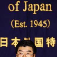 Point man: Environment Minister Sakihito Ozawa faces reporters Wednesday at the Foreign Correspondents\' Club of Japan in Tokyo. | AP PHOTO
