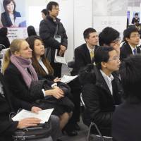 Forward thinking: Foreign students attend a briefing session during a job fair Saturday in Bunkyo Ward, Tokyo, hoping to secure employment before their graduation in 2013. | SATOKO KAWASAKI