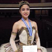 On the way up: Sporting a medal, Madoka Sugai holds her winners\' certificate at the prestigious Prix de Lausanne ballet competition in Switzerland on Saturday. | KYODO
