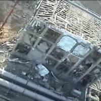 Danger: This April 10 image released the next day by Tokyo Electric Power Co. shows the hydrogen blast-damaged reactor 4 building at the Fukushima No. 1 power plant. Inside, a spent fuel pool holds 1,500 nuclear fuel assemblies. | TEPCO