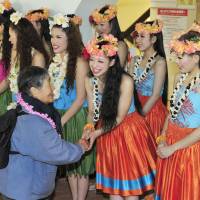 Aloha: Hula Girls at the Spa Resort Hawaiians in Iwaki, Fukushima Prefecture, greet a visitor after the resort fully resumed operations Wednesday. | KYODO