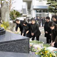 Maritime memorial: Relatives of the victims of the Ehime Maru sinking attend a service Friday in Uwajima, Ehime Prefecture, to mark the accident\'s 11th anniversary. | KYODO