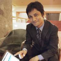 Language lord: Md Moin, founder of a firm that hires Filipinos to teach English online, shows his website. | KYODO