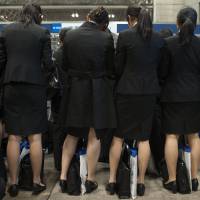 Trying to get ahead: College women attend a job fair at Makuhari Messe in the city of Chiba in December 2011. | BLOOMBERG