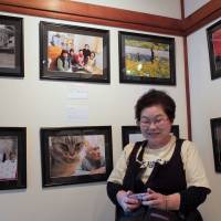 Featured: Takako Matsumura poses at the photo exhibition \"A Treasure Box of Otsuchi\" on Friday at Gallery Yasashii Yokan in Shinagawa Ward, Tokyo. The show runs till Monday. | SATOKO KAWASAKI