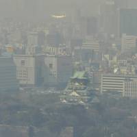 A yellow haze settles over Osaka as dust from China and Mongolia blows into town. | KYODO