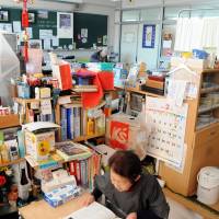 The cramped living quarters provided by the former classrooms, however, leaves them little privacy. | SATOKO KAWASAKI