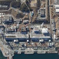 In an aerial photo Fukushima No. 1 nuclear power plant, the location of the power failure is shown in the top right corner.  | KYODO