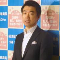 Overdid it: Osaka Mayor Toru Hashimoto holds a press conference Monday at City Hall. | KYODO