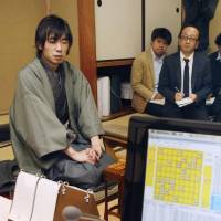 Checkmated: Shinichi Sato, a professional \"shogi\" player, is seen after losing to the Ponanza computer program on Saturday in Shibuya Ward, Tokyo. | KYODO