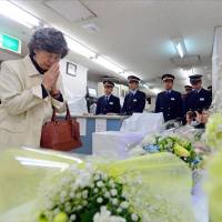 Widow\'s prayer: Shizue Takahashi, who lost her husband in the 1995 sarin gas attack on the Tokyo subway system, prays before an altar at Kasumigaseki Station in Chiyoda Ward during a ceremony Wednesday morning. The attack by Aum Shinrikyo 18 years ago killed 13 people and wounded more than 6,000.  | KYODO