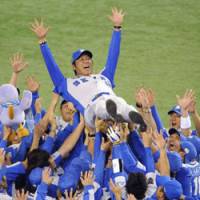 Air time: Seibu Lions\' manager Hisanobu Watanabe is given a celebratory toss in the air following his team\'s win over the Yomiuri Giants in the final game of the Japan Series | KYODO PHOTO
