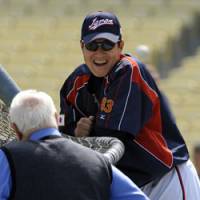Talking shop: Manager Tatsunori Hara talks with former Dodgers skipper Tommy Lasorda during Japan\'s workout at the World Baseball Classic on Friday in Los Angeles. | AP PHOTO